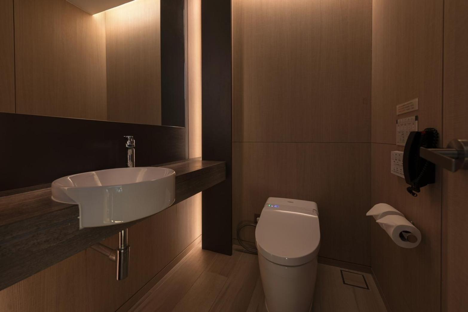 Mu Jiaoxi Hotel Экстерьер фото A modern bathroom